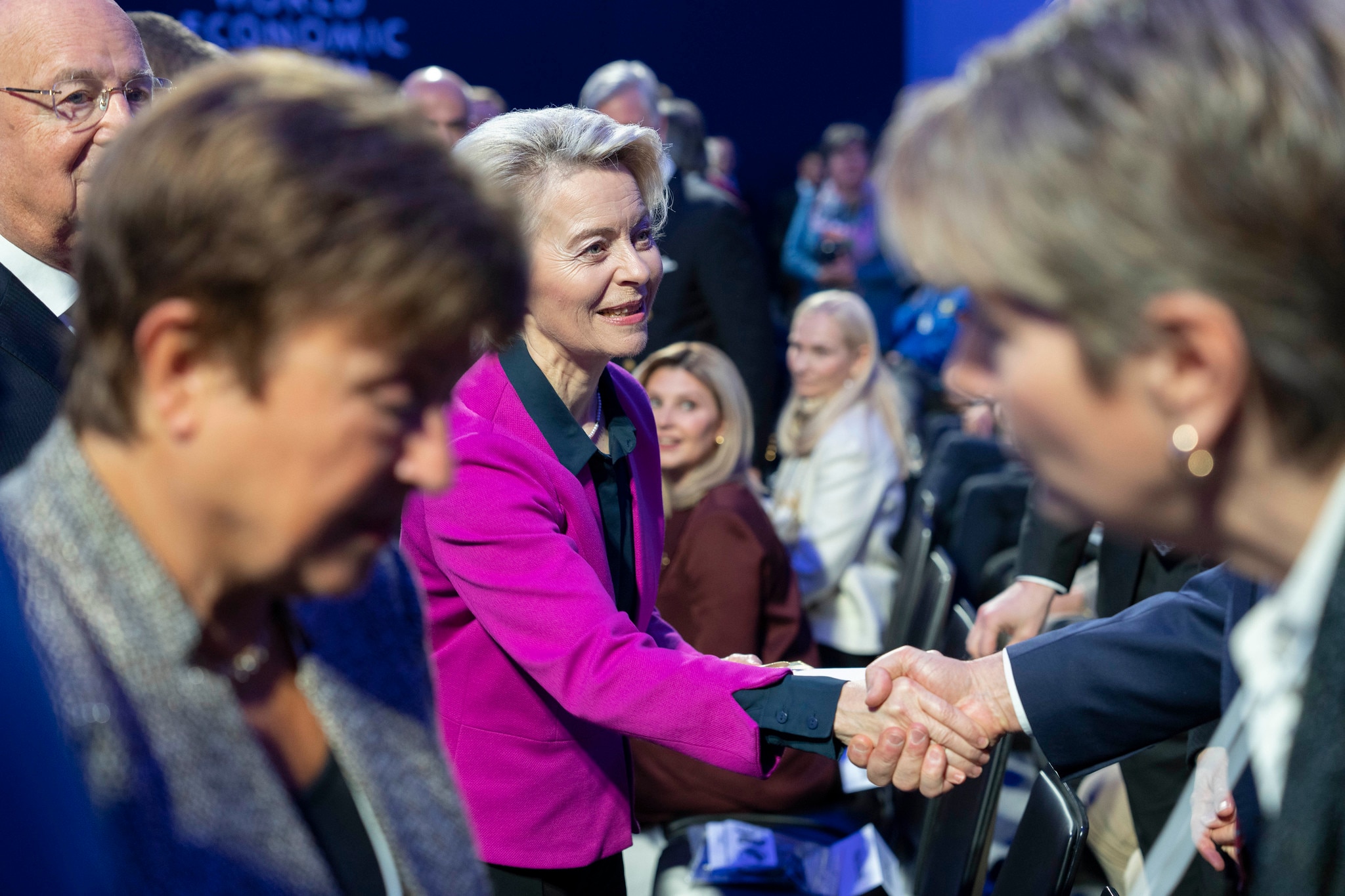 A woman shaking a hand